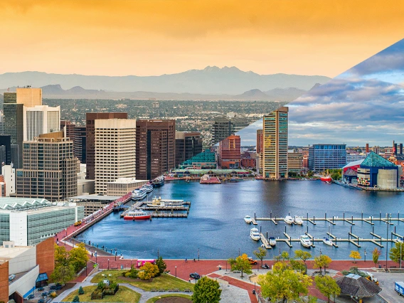 Image split diagonally with downtown Phoenix on the top left and downtown Baltimore on the bottom right.