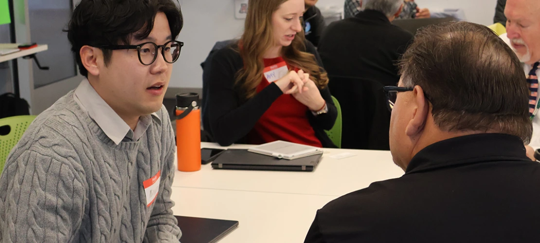 U of A Postdoctoral Researcher Minwoo Ahn chats with an attendee during a breakout session at the 2025 Southern Arizona Heat Summit