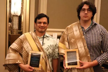 UCLA's Randall Akee and UArizona Public Health doctoral candidate William Carson accept Data Warrior awards on behalf of the deceased honorees.