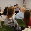 Joan Timeche delivers content at Native Know-How 2025, as seen from the back of the classroom with several seminar attendees in the foreground